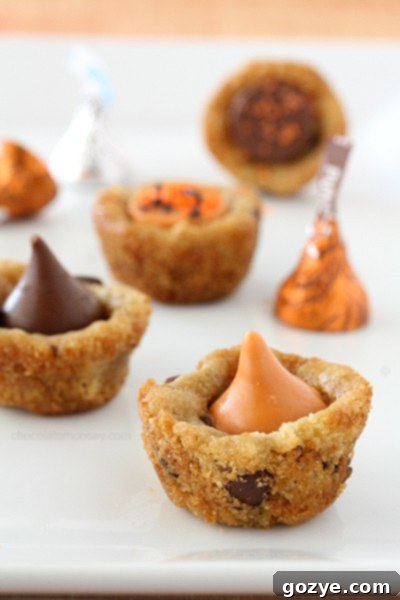 Pumpkin Spice Kiss Cookie Cups - Pin this easy Halloween dessert recipe!