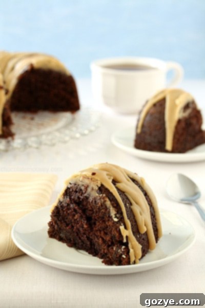Decadent Double Chocolate Espresso Bundt Cake with shimmering caramel glaze, ready to serve.