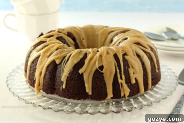 The finished Double Chocolate Espresso Bundt Cake, glistening with caramel glaze, ready for guests.