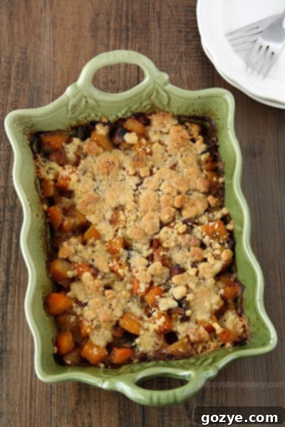Butternut Squash Crumble with bacon and mushrooms in a baking dish
