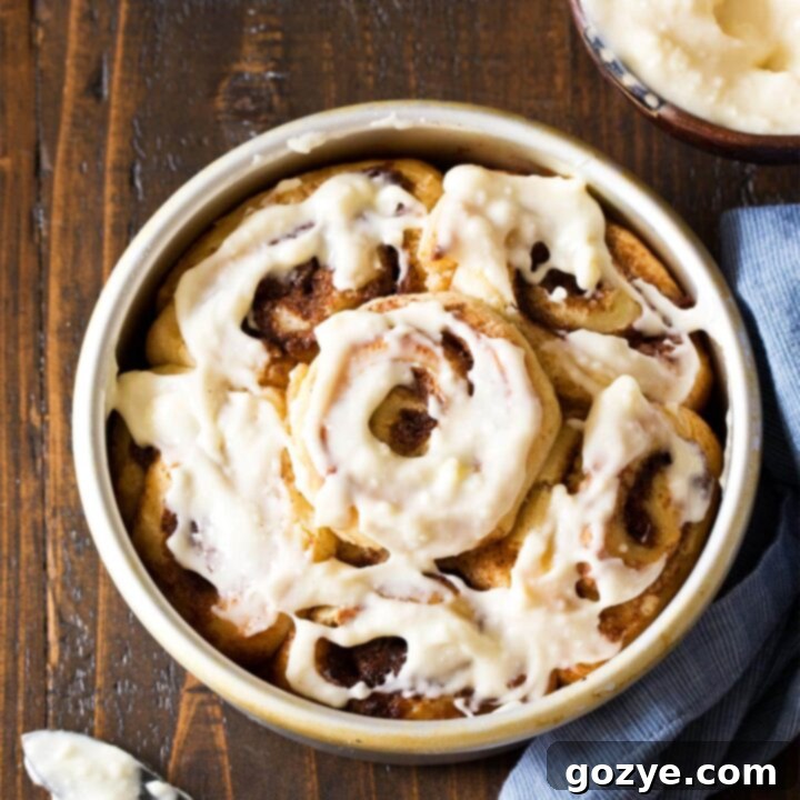 Quick & Cozy Cinnamon Rolls 12 Small Batch Cinnamon Rolls frosted in a round pan