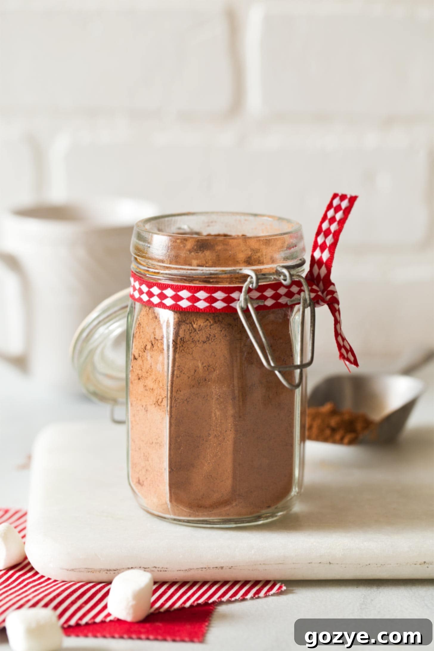 Jar of homemade hot chocolate mix with Christmas ribbon