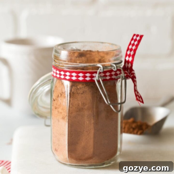 Jar of homemade hot chocolate mix with Christmas ribbon