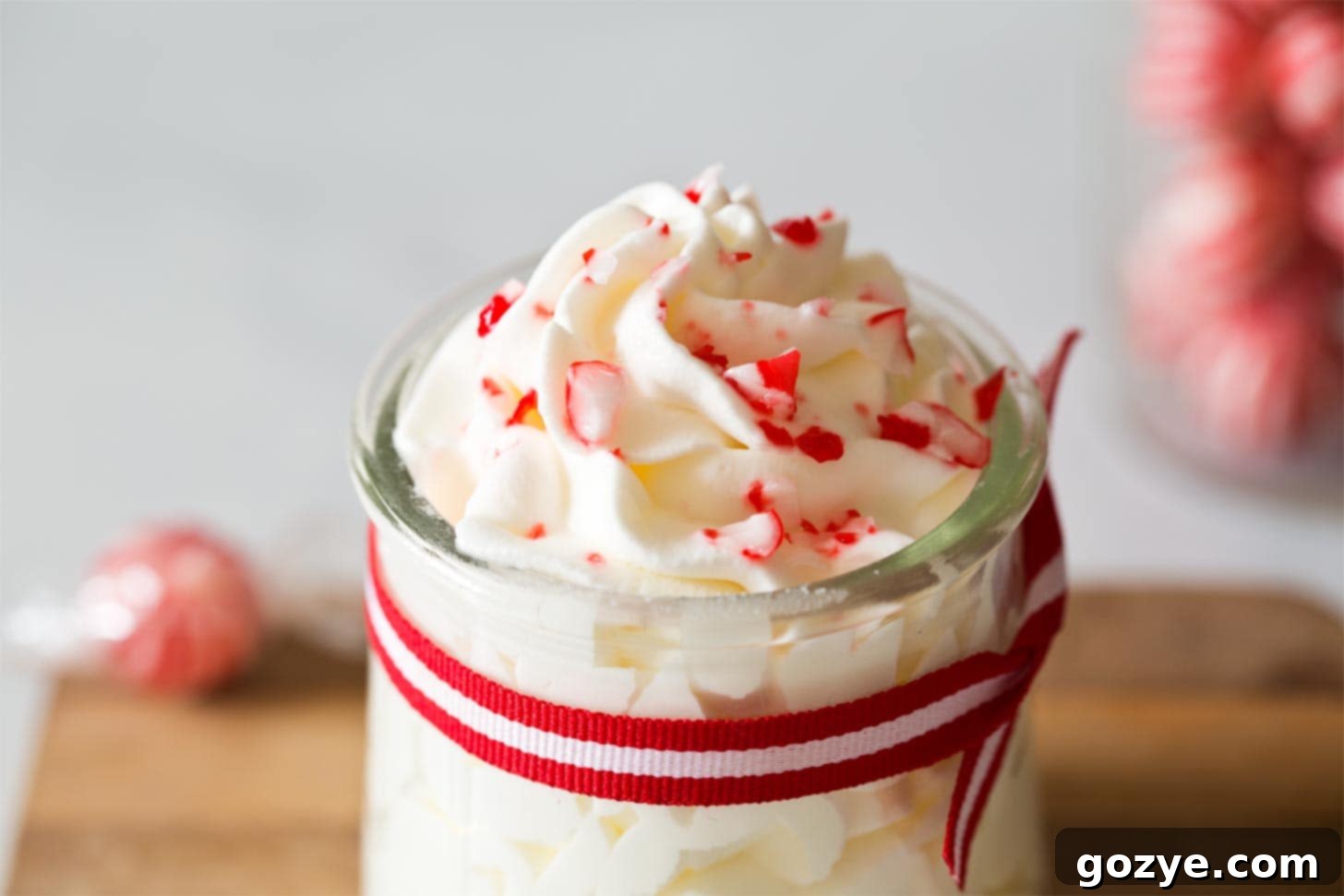 Close up of candy cane whipped cream in jar
