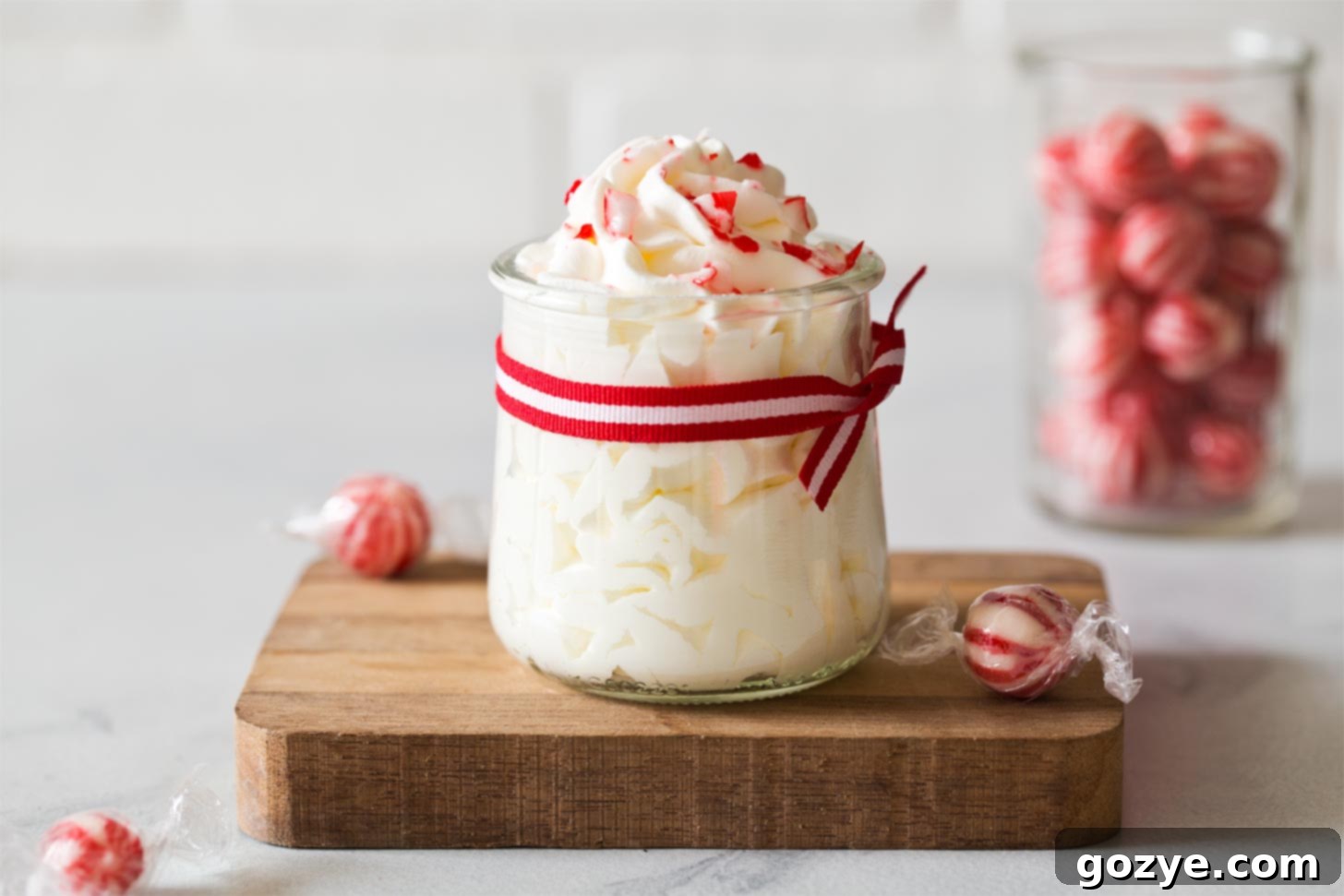 Wide shot of peppermint whipped cream on wooden board