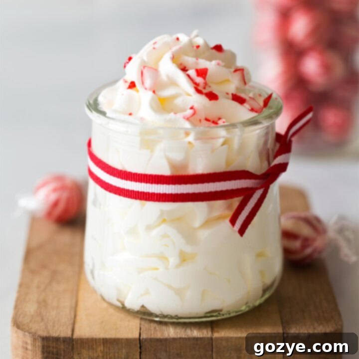 Peppermint whipped cream in a jar with red ribbon