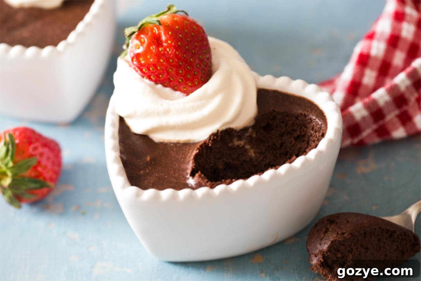 Chocolate mousse with a spoonful taken out, showing the texture