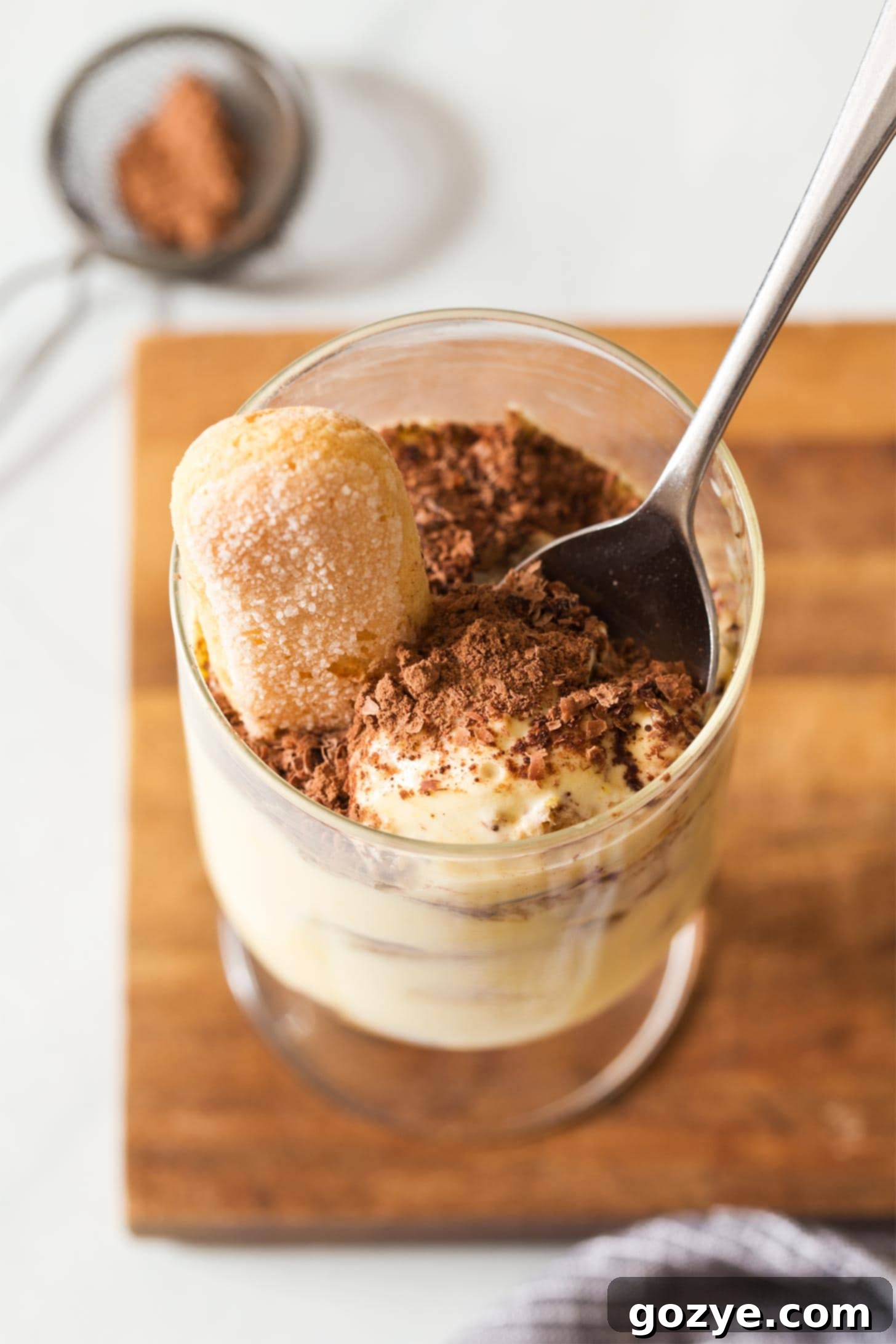 Spoon inside individual tiramisu